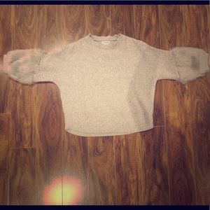 I am selling a gray sweater.
